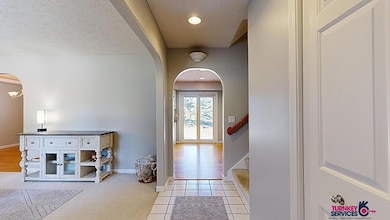 The entry way is a convenient spot to kick your shoes off & relax in the living room.