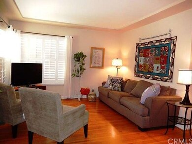 Living Room with Trey Ceiling, Hardwood Floor and 