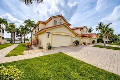Front of structure with 2 car garage and paver dri