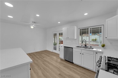 Kitchen with a sink, french doors, appliances with