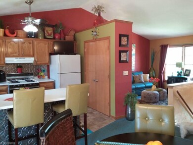 View from dining to kitchen and living room.