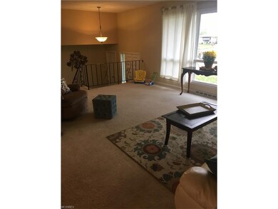 View of the Living Room with Foyer in background