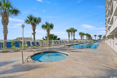 Community pool with a patio and a community hot tub