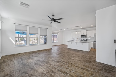 Unfurnished living room featuring dark wood finis