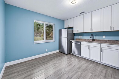 9087 W Highland Pines Blvd, Palm Beach Gardens, FL 33418 - photo 3