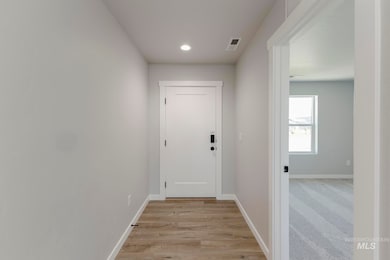Corridor featuring recessed lighting and light wood-type flooring