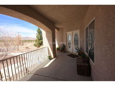 Facade/Exterior Front. Covered entry with views of