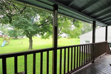 View of large backyard from back porch