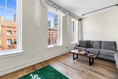 Living area featuring a city view, track lighting,