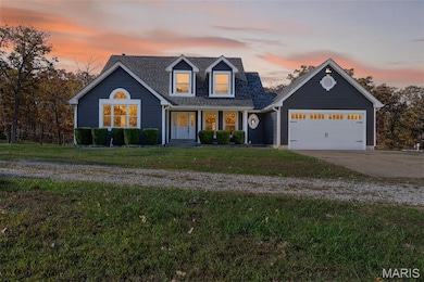 View of front of property featuring driveway, a front lawn, an attached garage, covered porch, and a shingled roof