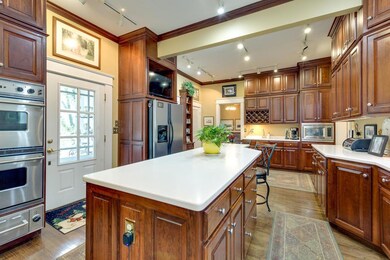 Kitchen features pantry area and center island