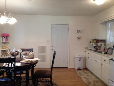 Kitchen. Kitchen and dining has laminate flooring