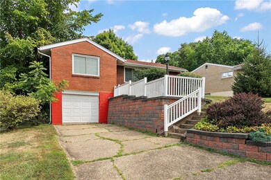 Newer garage door and space for 2 more cars in the driveway!