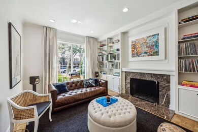Living area featuring built in shelves, recessed l