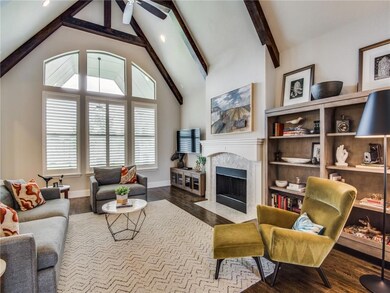 Soaring ceilings in living, plantation shutters up