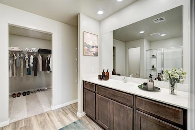 Spacious bathroom countertops are perfect for getting ready in the morning! *Virtually staged model home
