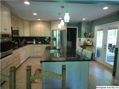 Gourmet kitchen. Blue pearl granite- maple cabinet