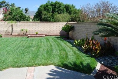 Backyard surrounded with block wall, block and bri