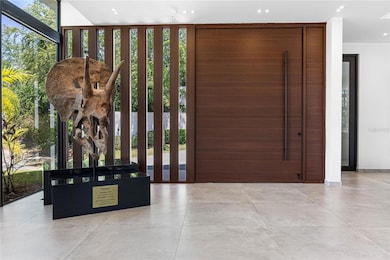 Set on a 2,286 square meter lot (approximately 0.56 acres) and spanning 9,562 square feet, the home is a masterclass in sophisticated design and effortless indoor-outdoor living.