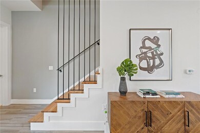 Stairs featuring baseboards and wood finished floors