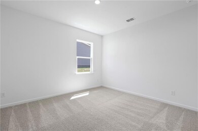 Unfurnished room with carpet flooring and baseboards