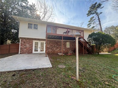 Back of house with a patio area, french doors, sta
