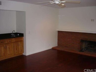 Interior View of Family Room with Wet Bar and Fire