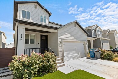 View of front facade featuring a porch, concrete driveway, a garage, and a residential view