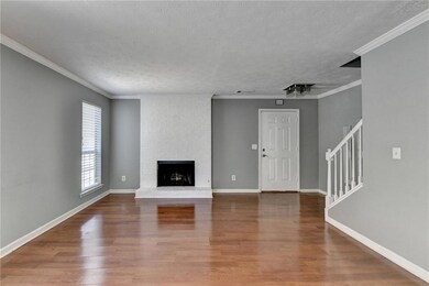 Unfurnished living room with wood finished floors,