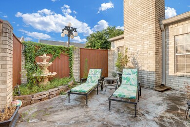 A small corner garden with fountain accentuates th