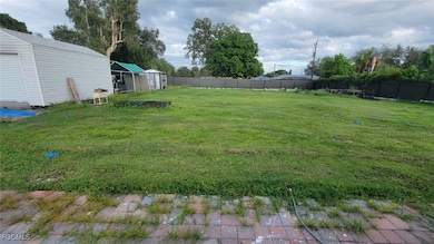 Fenced backyard with a shed