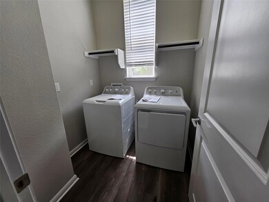Clothes washing area featuring laundry area, base