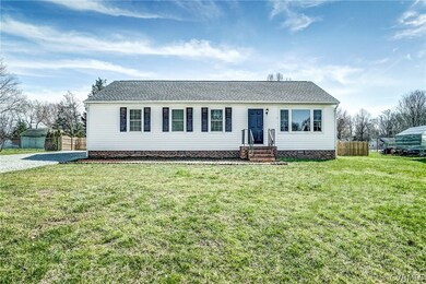 Ranch-style house featuring a front yard