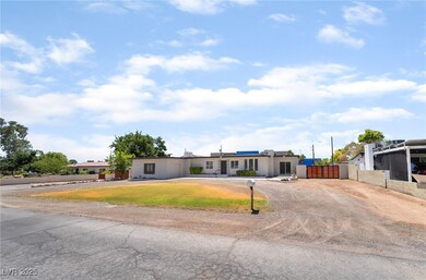View of front facade featuring dirt driveway and a