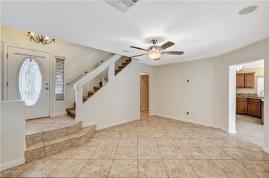 Foyer with stairs, healthy amount of natural light