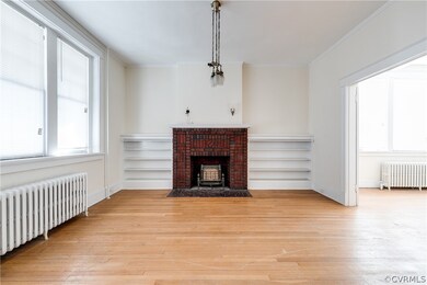 Fireplace wrapped with built-in bookcases, in the living room.