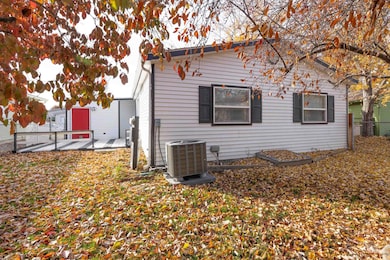 View of property exterior featuring a central air condition unit and a patio