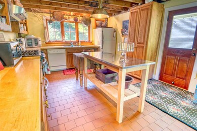 The cleam and well stocked kitchen open s to dinin
