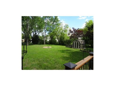 BACKYARD VIEW FROM DECK - FIREPIT & STORAGE SHED.