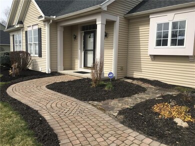 A welcoming walkway and covered entry greats guest