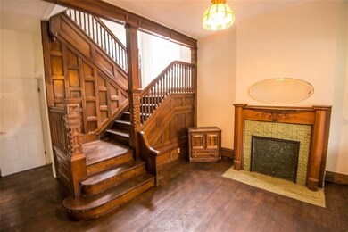 Bright entry way with fresh paint, refinished hard