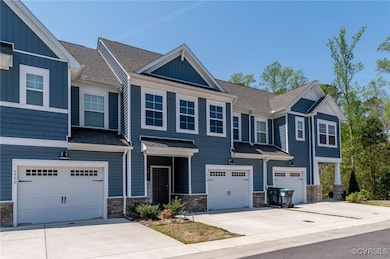 Townhome / multi-family property featuring drivewa
