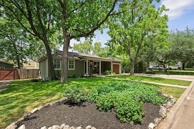 Ranch-style home with an attached garage and a ga