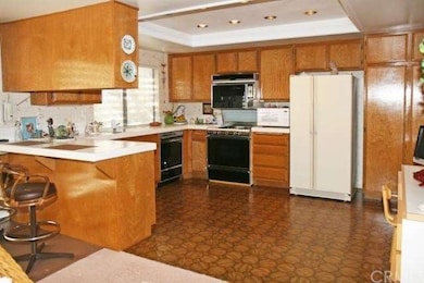 Huge kitchen with breakfast bar, recessed lights ,