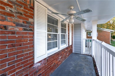 Balcony with ceiling fan and a porch