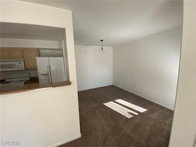 Unfurnished living room featuring dark colored car