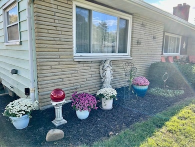 Stone Front Facade Colorful Landscaping