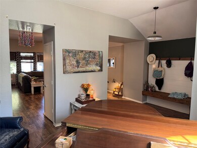 Formal dining room with view from the back of the room toward the entryway.