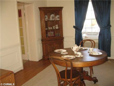 Dining Room - Hardwood flooring, crown, chair, and