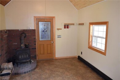 Over-sized mudroom with Jotul...